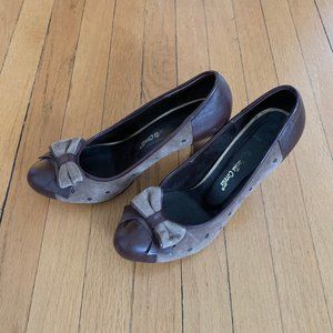 Vintage-style brown and beige heels with bow